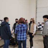 a group of people in front of a project